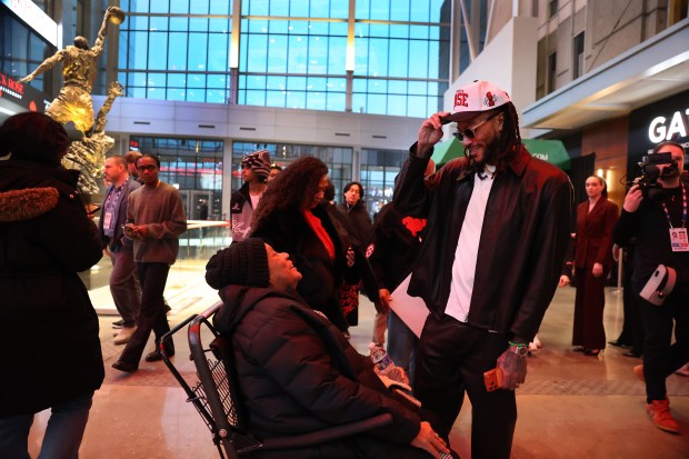 Derrick Rose chats with his mother Brenda (cq) inside the United Center atrium, decorated in his honor, prior to his #1 jersey being retired by the Chicago Bulls in a ceremony scheduled for after a game between the Bulls and the Boston Celtics on Jan. 24, 2026. (Chris Sweda/Chicago Tribune)