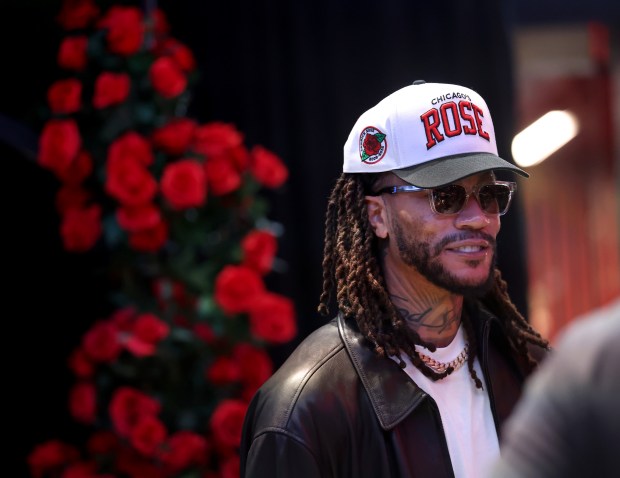 Derrick Rose takes a quick peek at the United Center atrium, decorated in his honor, prior to his #1 jersey being retired by the Chicago Bulls in a ceremony scheduled for after a game between the Bulls and the Boston Celtics on Jan. 24, 2026. (Chris Sweda/Chicago Tribune)