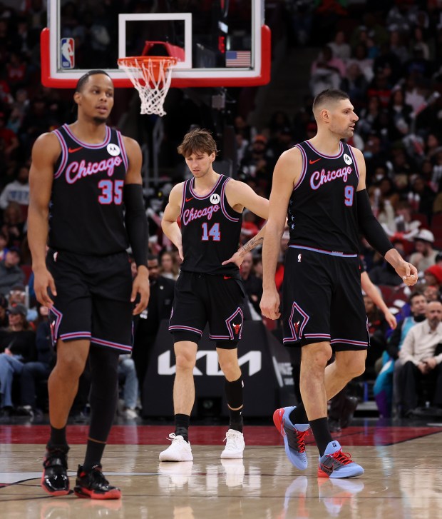 Chicago Bulls forward Matas Buzelis (14) walks on back to the bench to start a timeout in the second half of a game against the Charlotte Hornets at the United Center in Chicago on Jan. 3, 2026. (Chris Sweda/Chicago Tribune)