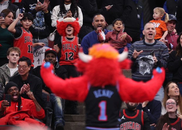 People react before Benny the Bull throws t-shirts into the crowd in the first half of a game between the Chicago Bulls and the Charlotte Hornets at the United Center in Chicago on Jan. 3, 2026. (Chris Sweda/Chicago Tribune)