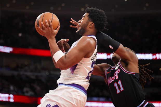 Chicago Bulls guard Ayo Dosunmu (11) commits a flagrant foul against Utah Jazz forward Brice Sensabaugh (28) during the second quarter at the United Center Jan. 14, 2026 in Chicago. (Armando L. Sanchez/Chicago Tribune)