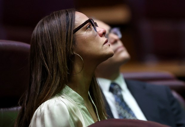 Ald. Rossana Rodríguez-Sánchez, 33rd, tears up while listening in to accounts of negative interactions with ICE as described by Elliott Payne, president of the Minneapolis City Council, during a virtual meeting at a committee hearing on solidarity with Minnesota at Chicago's City Hall, Jan. 27, 2026. (Chris Sweda/Chicago Tribune)