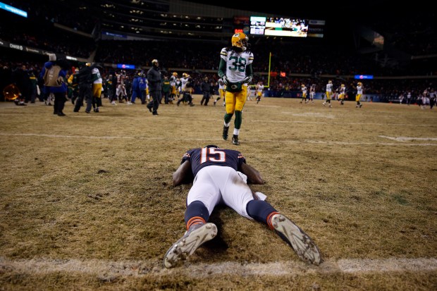 Brandon Marshall lies on the turf after the Chicago Bears lost 33-28 to the Green Bay Packers at Soldier Field in Chicago on Dec. 29, 2013. (Scott Strazzante/Chicago Tribune)