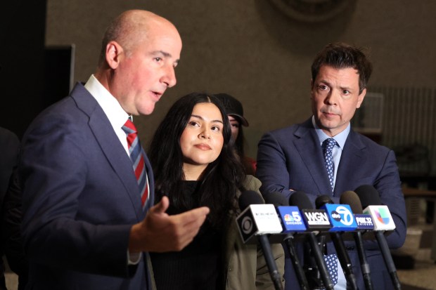 Attorney Christopher Parente, left, speaks to reporters at the Dirksen U.S. Courthouse in Chicago on Nov. 20, 2025, as his client Marimar Martinez, center, and law partner Damon Cheronis, right, look on after federal prosecutors abruptly moved to dismiss all charges against Martinez. (Terrence Antonio James/Chicago Tribune)