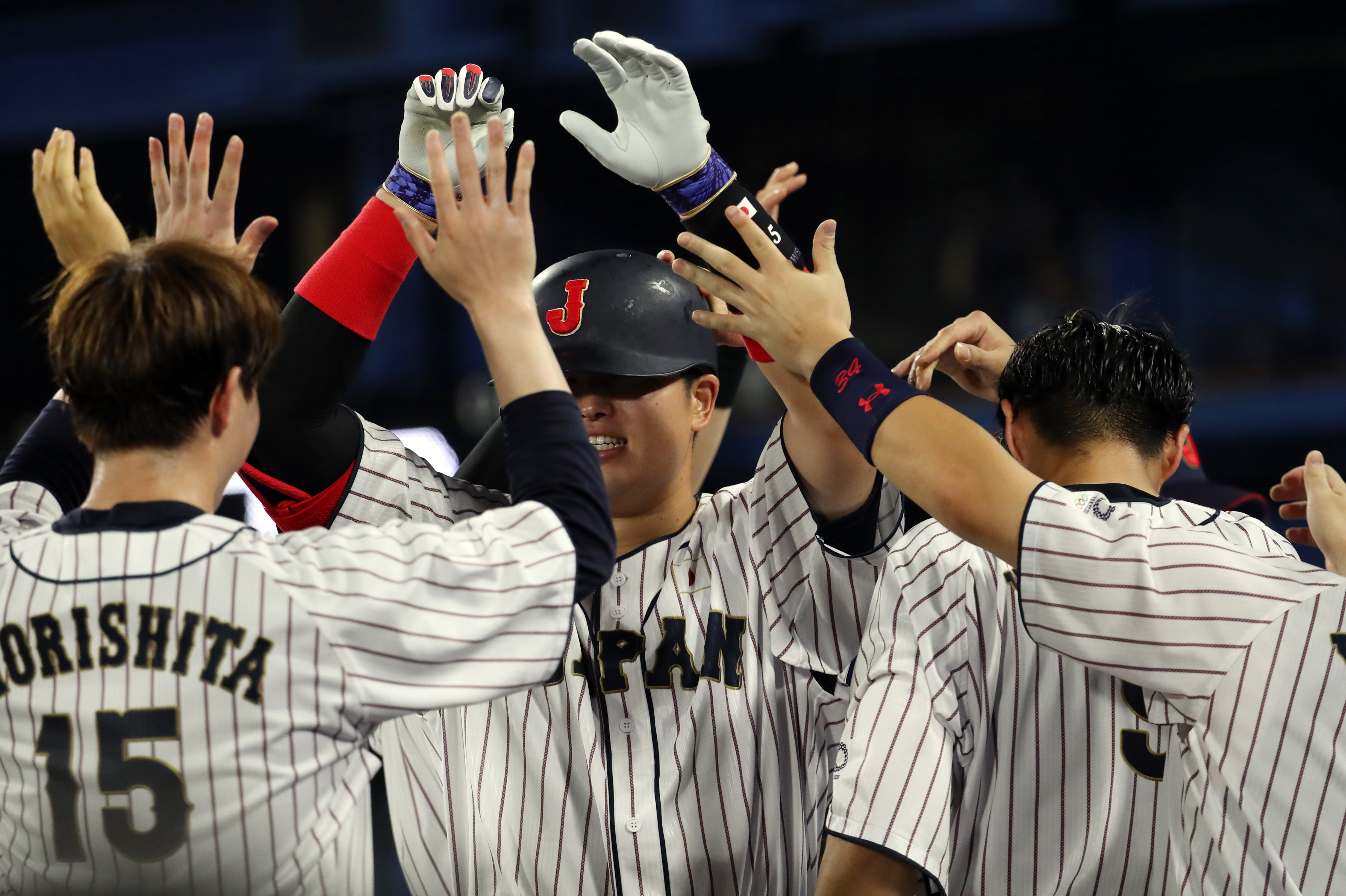 Japan infielder Munetaka Murakami (55) celebrates a solo home run...