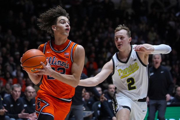 Illinois guard Keaton Wagler, left, drives past Purdue guard Fletcher Loyer during the first half Saturday, Jan. 24, 2026, in West Lafayette, Ind. (Michael Conroy/AP)