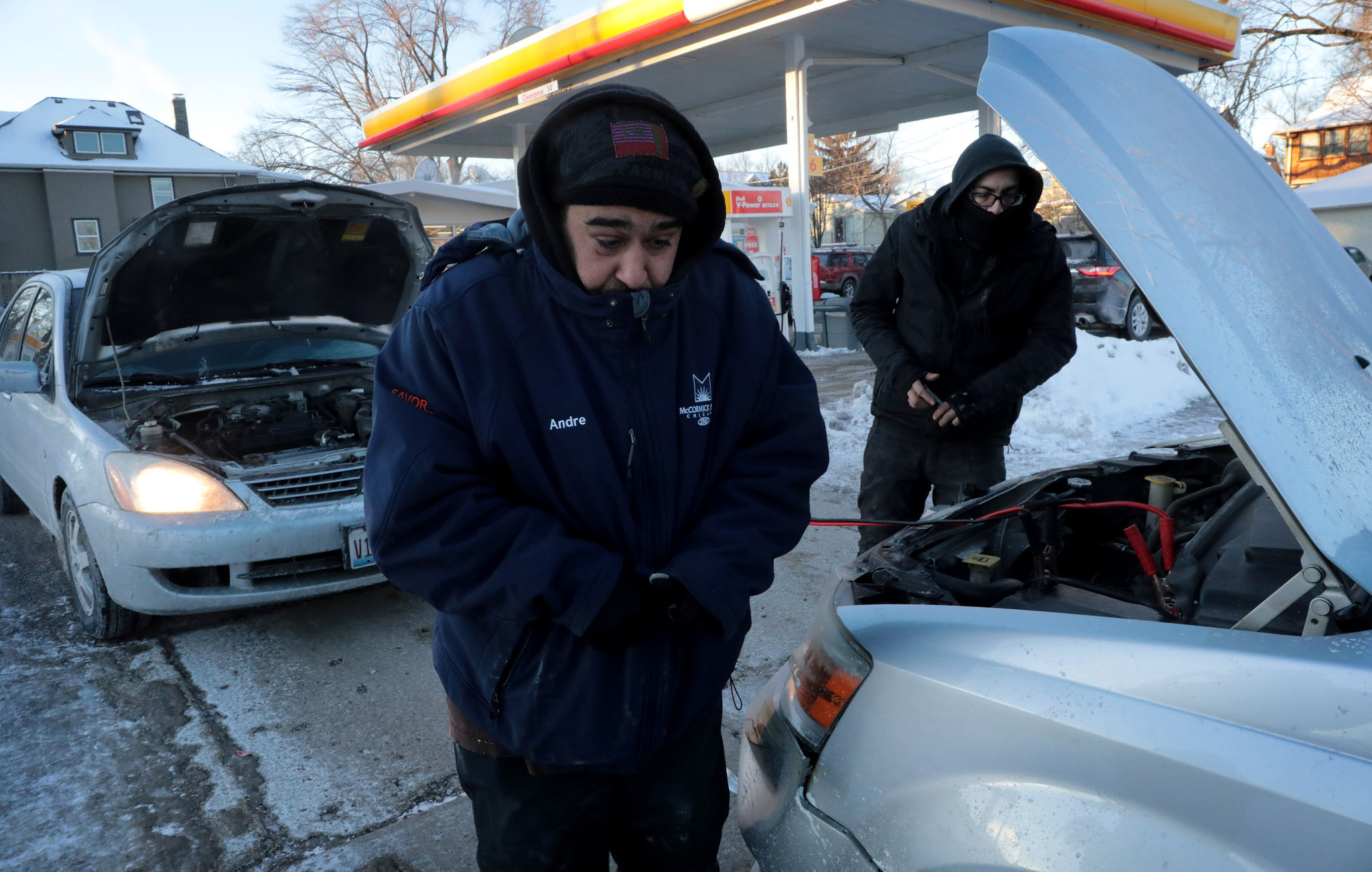 Andre Torres, left, waits to hear hisÂ engine to start as...