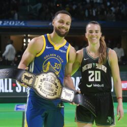 Golden State Warriors guard Stephen Curry and New York Liberty guard Sabrina Ionescu pose for photos following their competition at the NBA basketball All-Star weekend, Saturday, Feb. 17, 2024, in Indianapolis. (AP Photo/Darron Cummings)