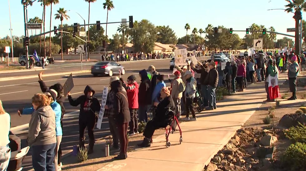 Demonstrators gathered near Bell Road and North Civic Center Drive in Surprise to protest the...