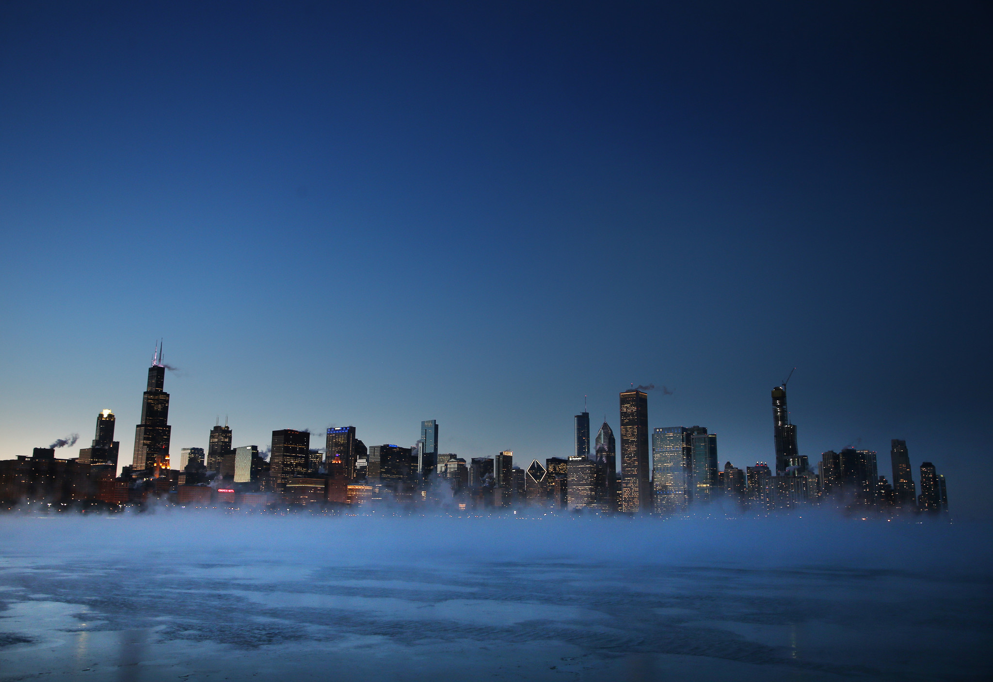 Downtown Chicago and Lake Michigan are seen in late afternoon...