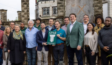 SPAR Executive Director Michael Haskins stands center with District 7 City Councilmember Jimmy Peluso, joined by other city and community stakeholders, at the Dec. 8 press conference announcing SPAR’s acquisition of the Drew Mansion.