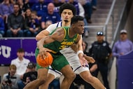 Baylor center James Nnaji (50) moves the ball during an NCAA college basketball game against...