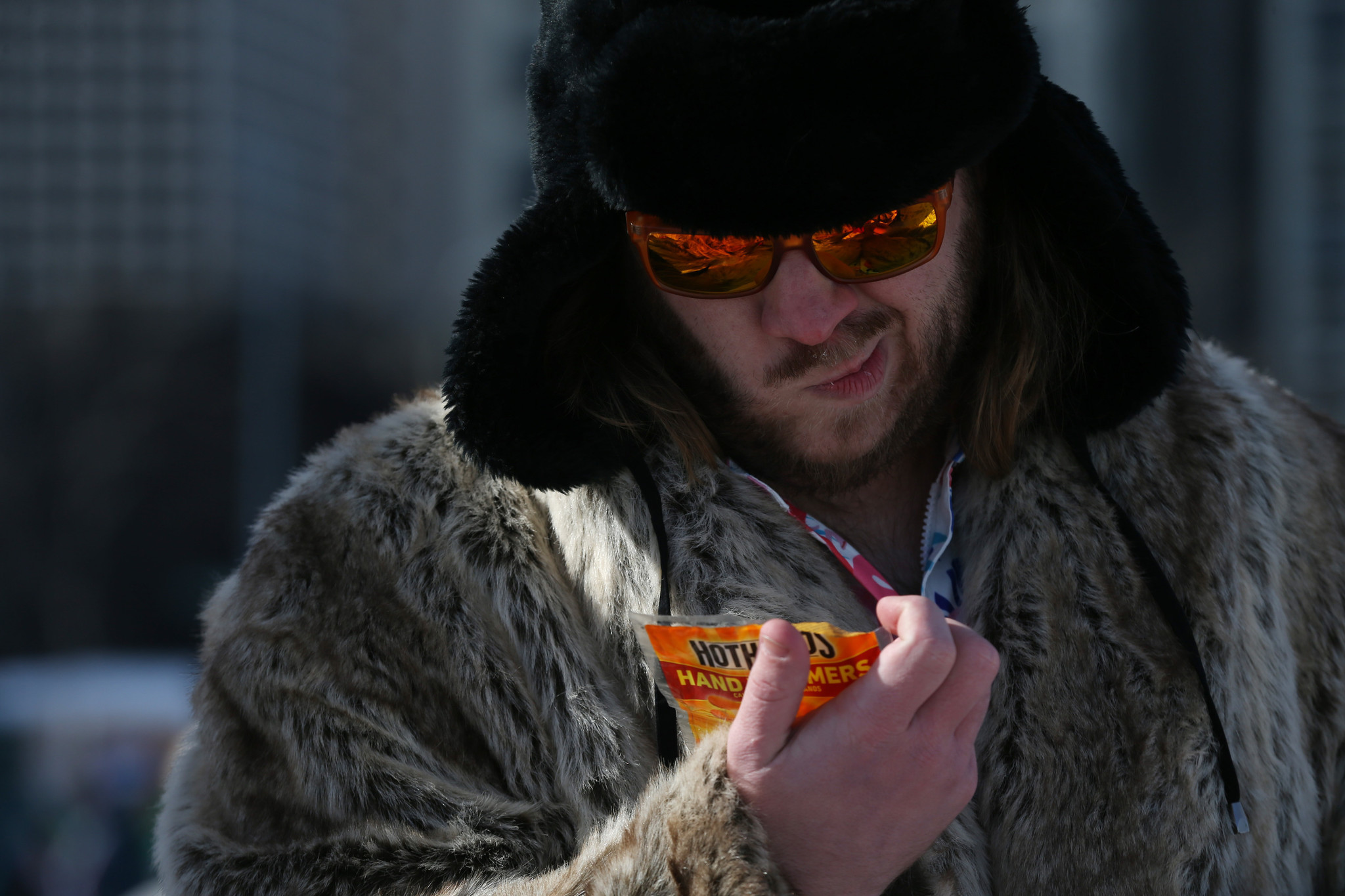 Justin Leverenz reads the instructions for hand warmers before participating...