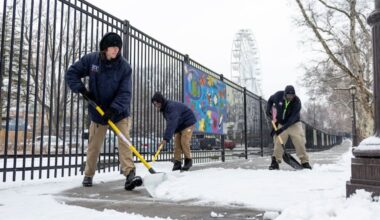 (From left to right) Philadelphia Zoo Garden Service workers Joseph Mineer, of Fairmount; Naeem Price, of North Philadelphia; and David Wallace, of Southwest Philadelphia, are shoveling snow on the sidewalks near the bus drop-offs in Philadelphia, Pa., on Saturday, Jan. 17, 2026.