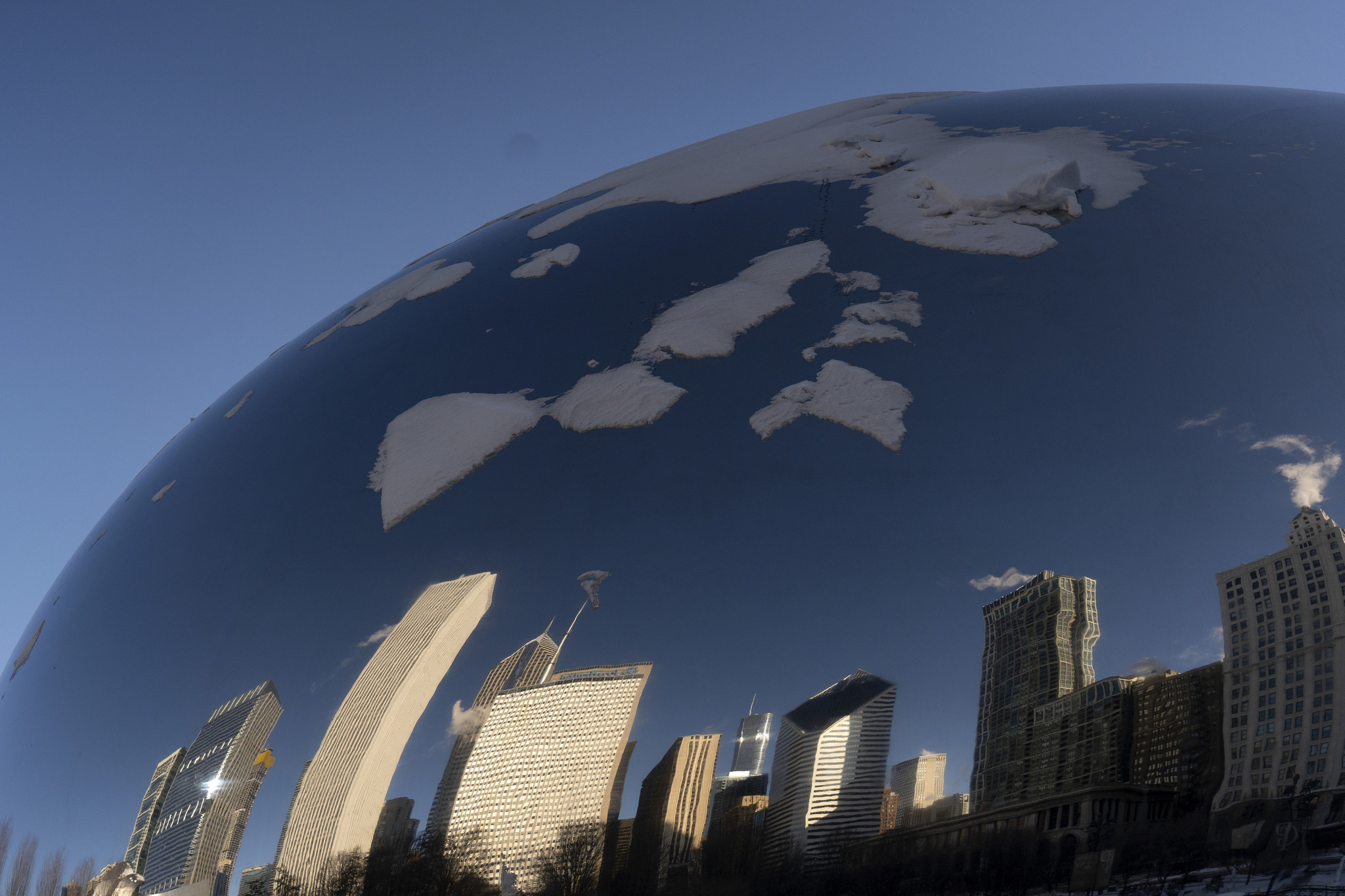 Snow and ice cover Cloud Gate as the sculpture is...