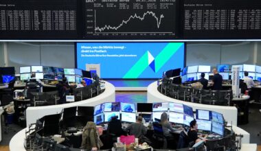 Dollar dips, gold at record high as US prosecutors target Fed's Powell