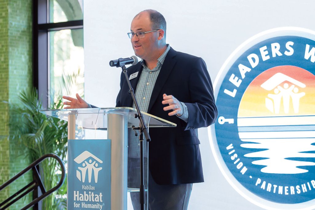 Folds speaking at a leadership summit at The Jessie