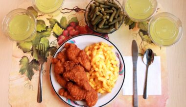 This undated photo provided by the National Institutes of Health in June 2019 shows an "ultra-processed" lunch including brand name macaroni and cheese, chicken tenders, canned green beans, and diet lemonade. Researchers found people ate an average of 500 extra calories a day when fed mostly processed foods, compared with when the same people were fed minimally processed foods. That’s even though researchers tried to match the meals for nutrients like fat, fiber, and sugar.