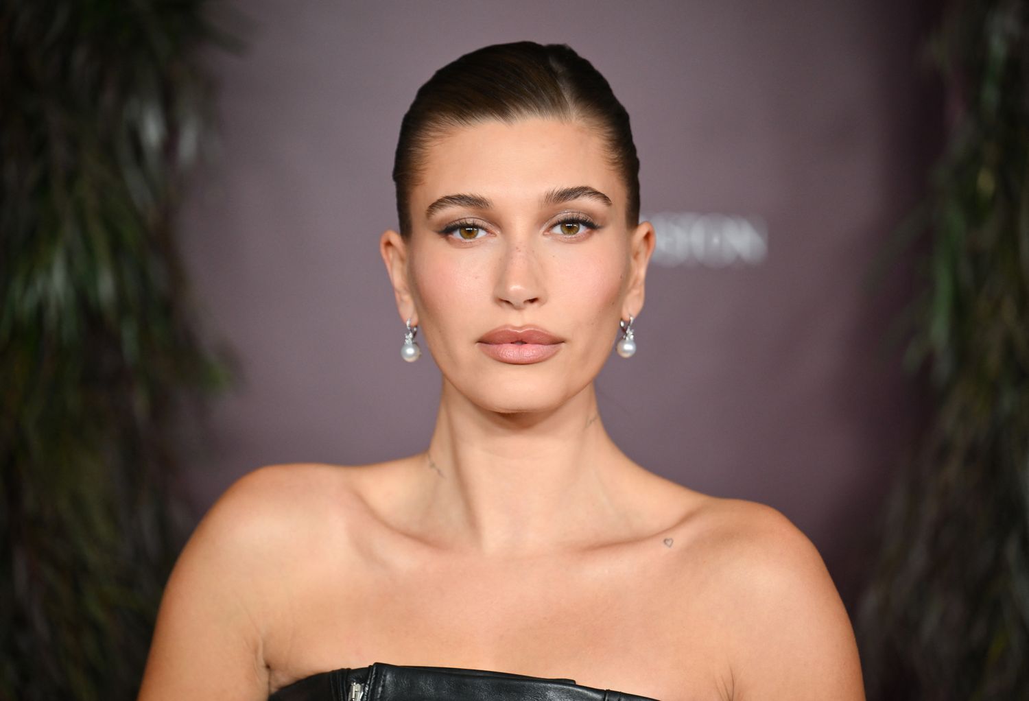 Hailey Bieber Wears a Plunging Corset With Low-Rise Gen Z Pants For Night Out