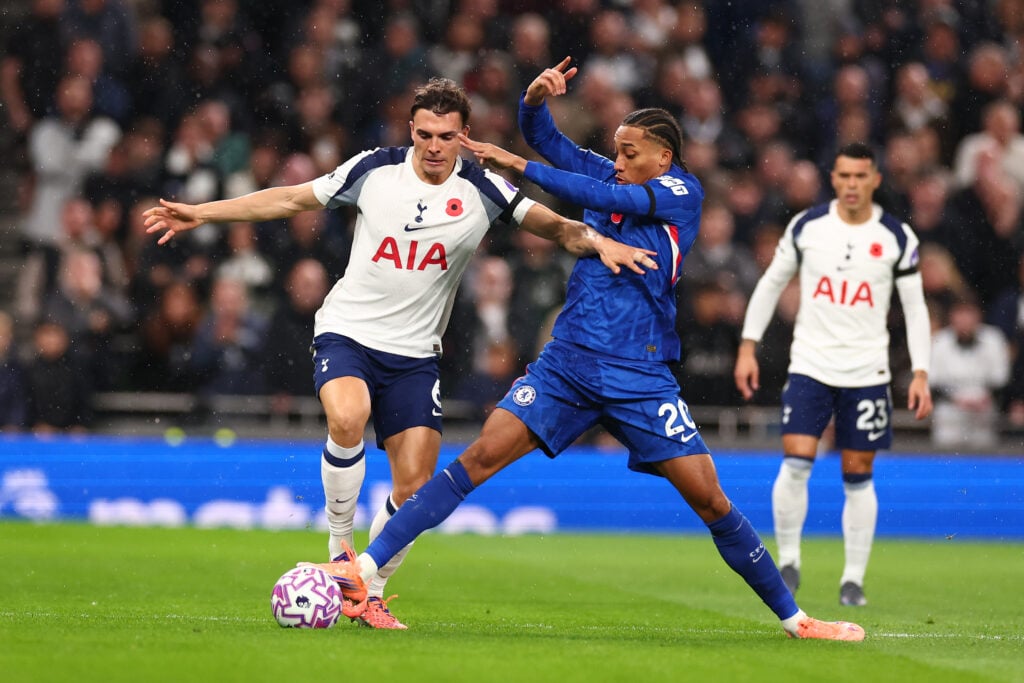 Joao Pedro of Chelsea challenges Joao Palhinha of Tottenham Hotspur