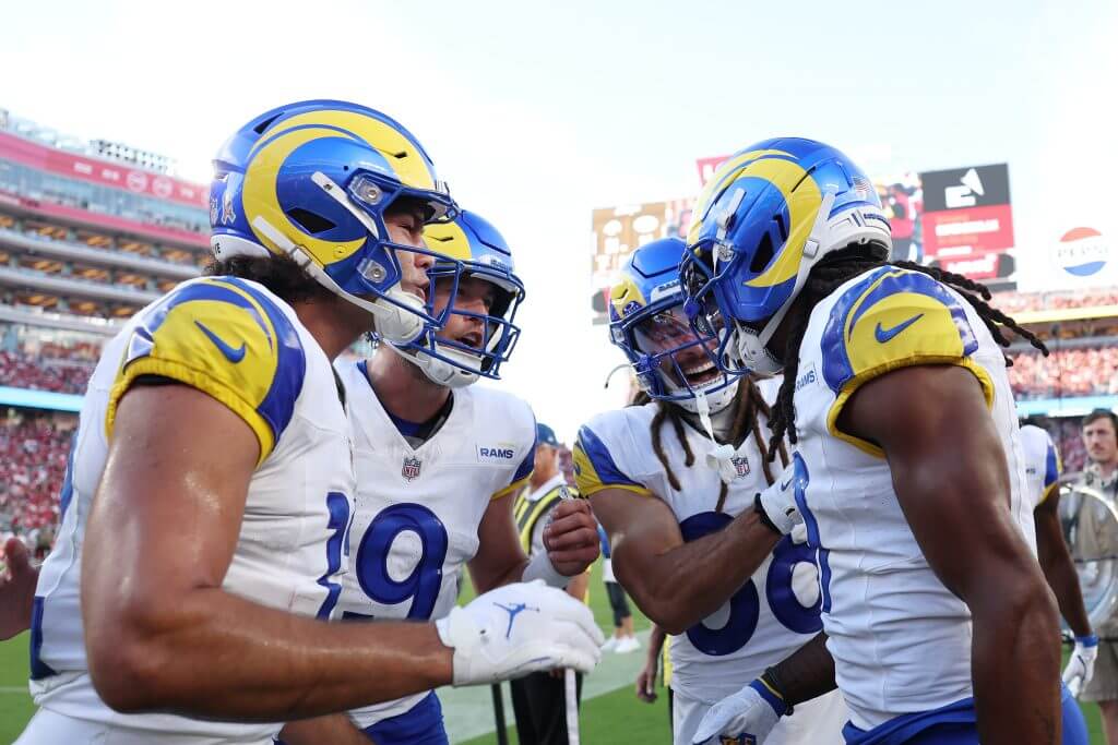 Matthew Stafford and the Rams celebrate a Davante Adams touchdown catch.