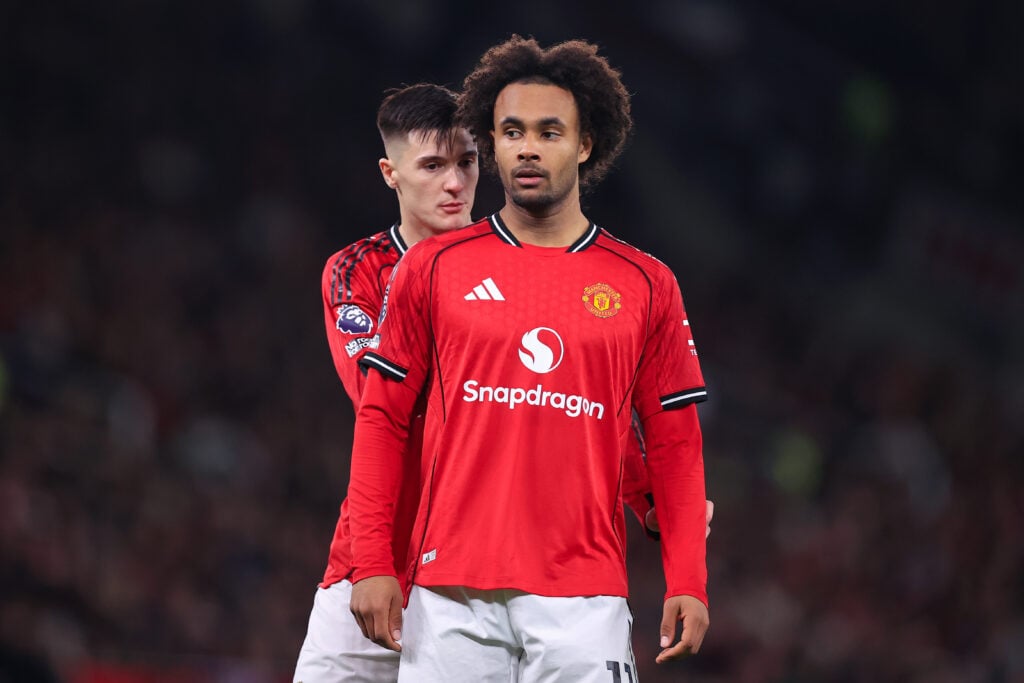 Benjamin Sesko walks behind Joshua Zirkzee during the Premier League match between Manchester United and Wolves at Old Trafford in 2025 in Manchester, England.