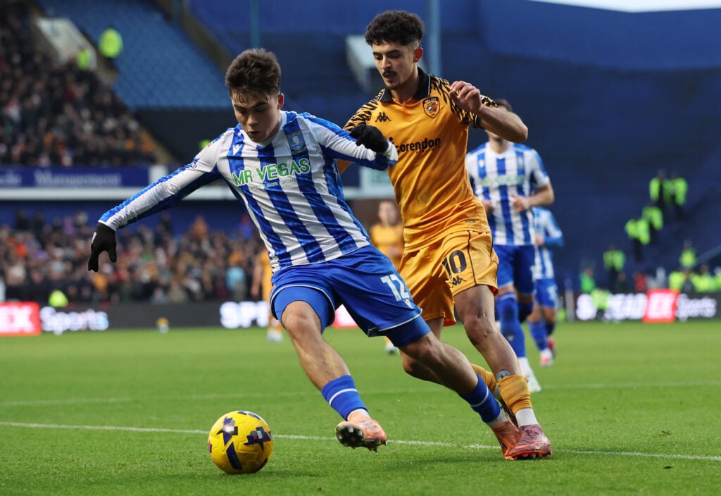 Harry Amass battles for the ball for Sheffield Wednesday.