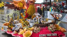 The California Community Foundation and Black Freedom Fund "The Rising Together" float to honor victims of the Altadena, Pasadena, Pacific Palisades and Malibu wildfires features a Phoenix rising as it moves down the parade route in the rain during the 137th Rose Parade on New Years Day in Pasadena, California, on January 1, 2026. The parade features floral floats, marching bands and equestrian units to ring in the New Year along the 5.5 mile (8.8 km) route along Colorado Blvd in Pasadena. (Photo by Patrick T. Fallon / AFP via Getty Images)