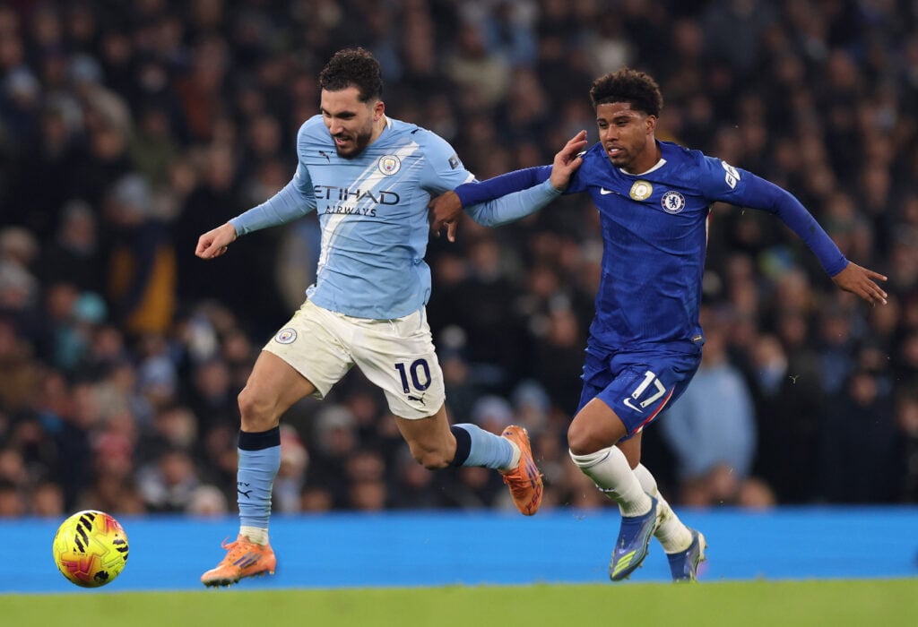 Rayan Cherki of Manchester City is challenged by Andrey Santos