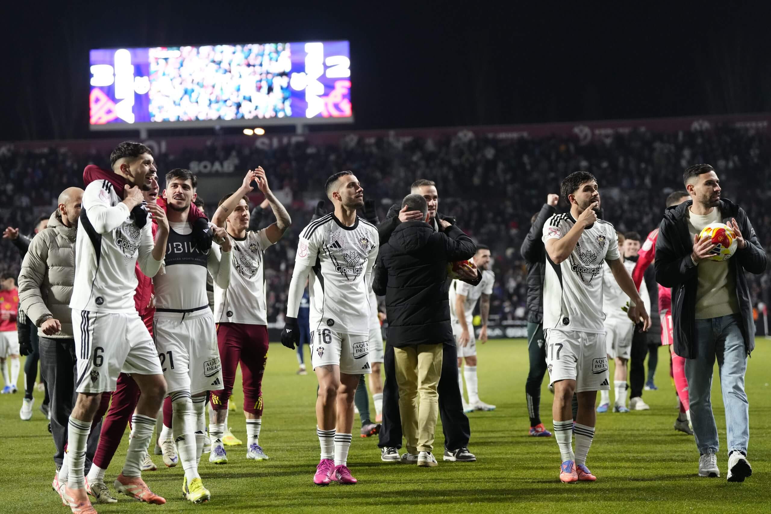 Albacete's players celebrate a famous win