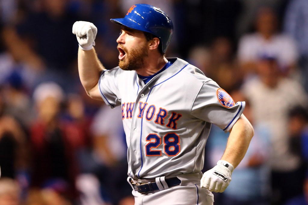 Daniel Murphy #28 of the New York Mets celebrates after hitting a two run home run in the eighth inning against Fernando Rodney #57 of the Chicago Cubs during game four of the 2015 MLB National League Championship Series at Wrigley Field on October 21, 2015 in Chicago, Illinois.  