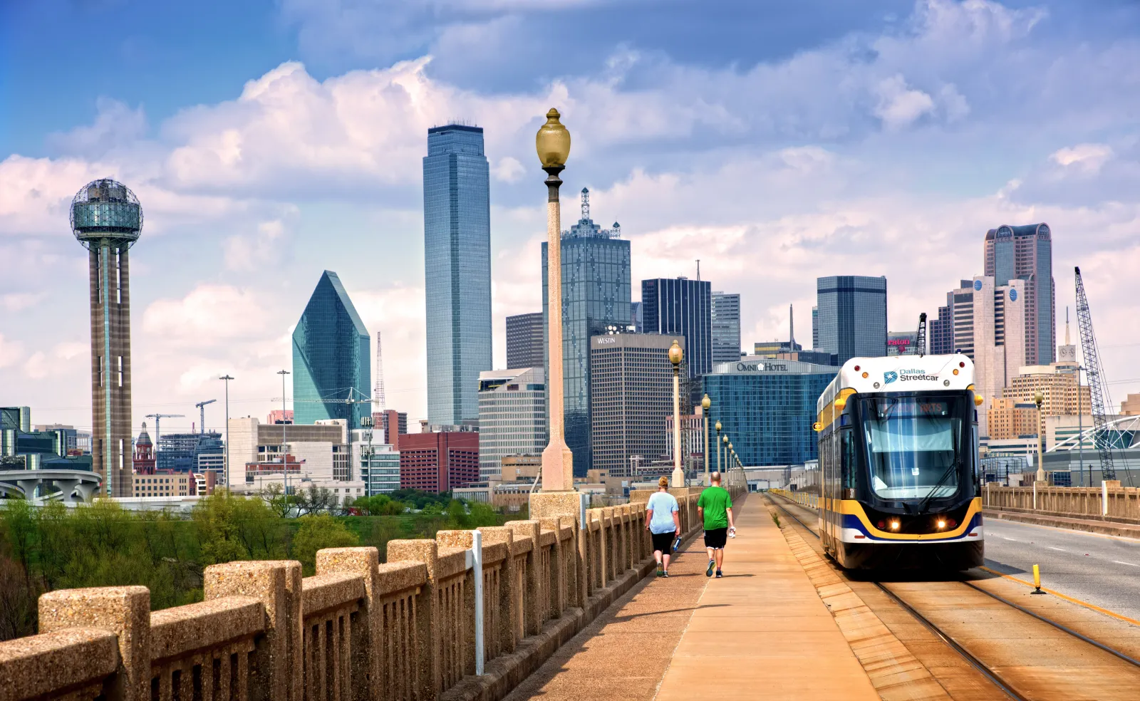 Commuter streetcar rides the tracks along the Houston Street Viaduct.