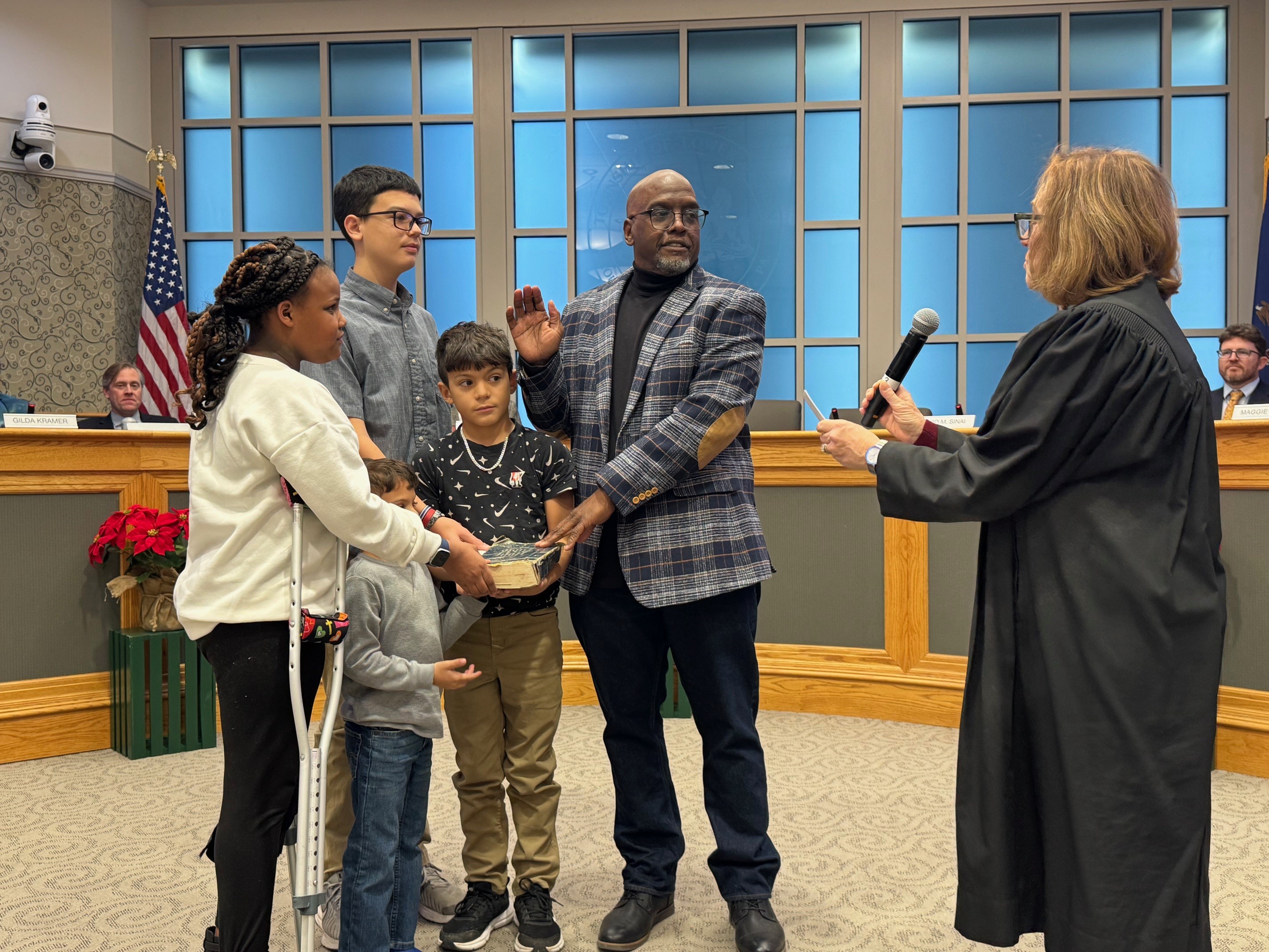 Charles Gregory being sworn in as Commissioner in Ward 4...