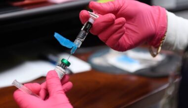 Anna Hicks prepares a measles, mumps and rubella vaccine at the Andrews, Texas County Health Department in April. The University of Pennsylvania's Annenberg Public Policy Center has been conducting surveys on the public's attitude toward vaccines like MMR and its trust in federal health agencies.