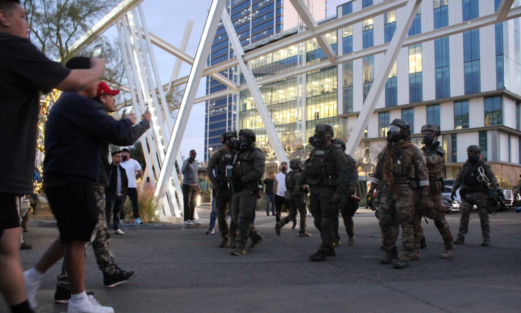 protesters face off with ice agents outside a zipps in midtown phoenix