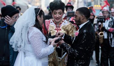 Hegeman String Band captain Kelliann Gallagher officiates the wedding of Julianna Bonilla (left) and Stanley Wells (right) during the 2026 Mummers Parade in Philadelphia on Thursday, Jan. 1, 2026.