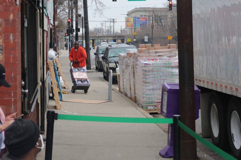 Food arrives for distribution at Above and Beyond Food Pantry, 817 S. Pulaski Rd.