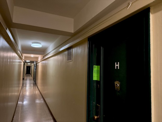 A 76-year-old woman was found dead with multiple injuries inside her apartment on Monroe St. near Market St., just a block from the Manhattan Bridge, on Saturday, Dec. 20, 2025. (Rebecca White / New York Daily News)