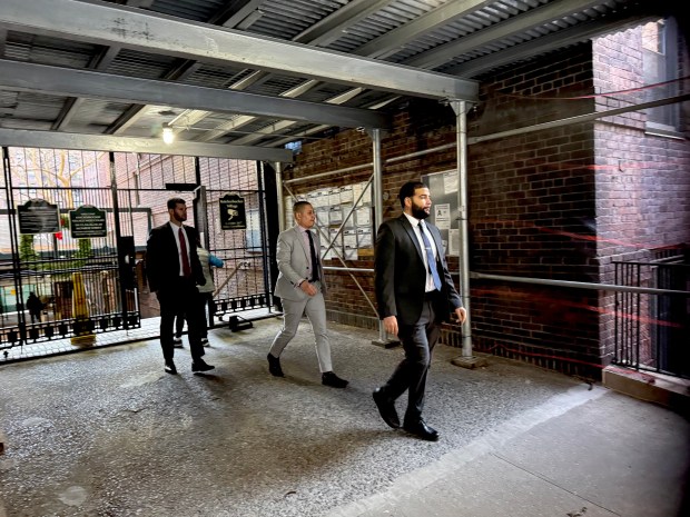 A 76-year-old woman was found dead with multiple injuries inside her apartment on Monroe St. near Market St., just a block from the Manhattan Bridge, on Saturday, Dec. 20, 2025. (Rebecca White / New York Daily News)