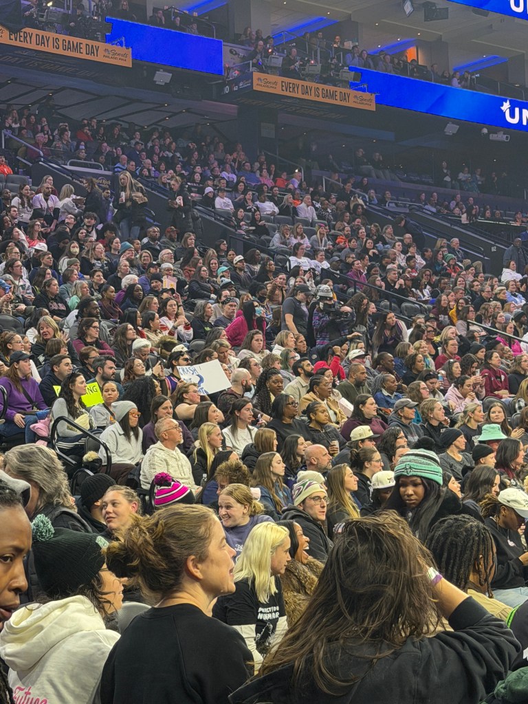 Fans watch Unrivaled from the stands at Xfinity Mobile Arena. The stands are packed, with few empty seats visible.