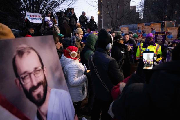 A photo of Alex Pretti is displayed during a vigil for Alex Pretti held by nurses and their supporters outside VA NY Harbor Healthcare System, Thursday, Jan. 29, 2026, in New York. (AP Photo/Yuki Iwamura)