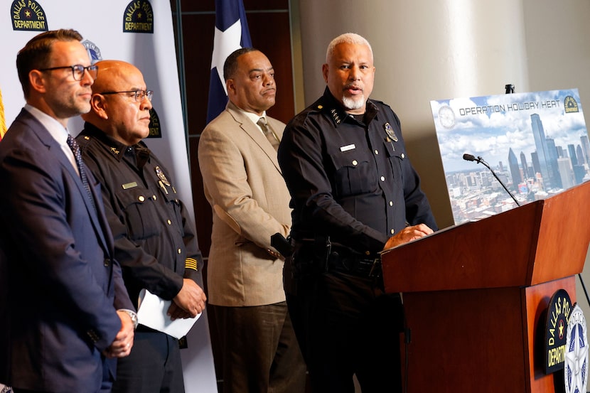 Dallas police Chief Daniel C. Comeaux (right) spoke at a news conference announcing the...