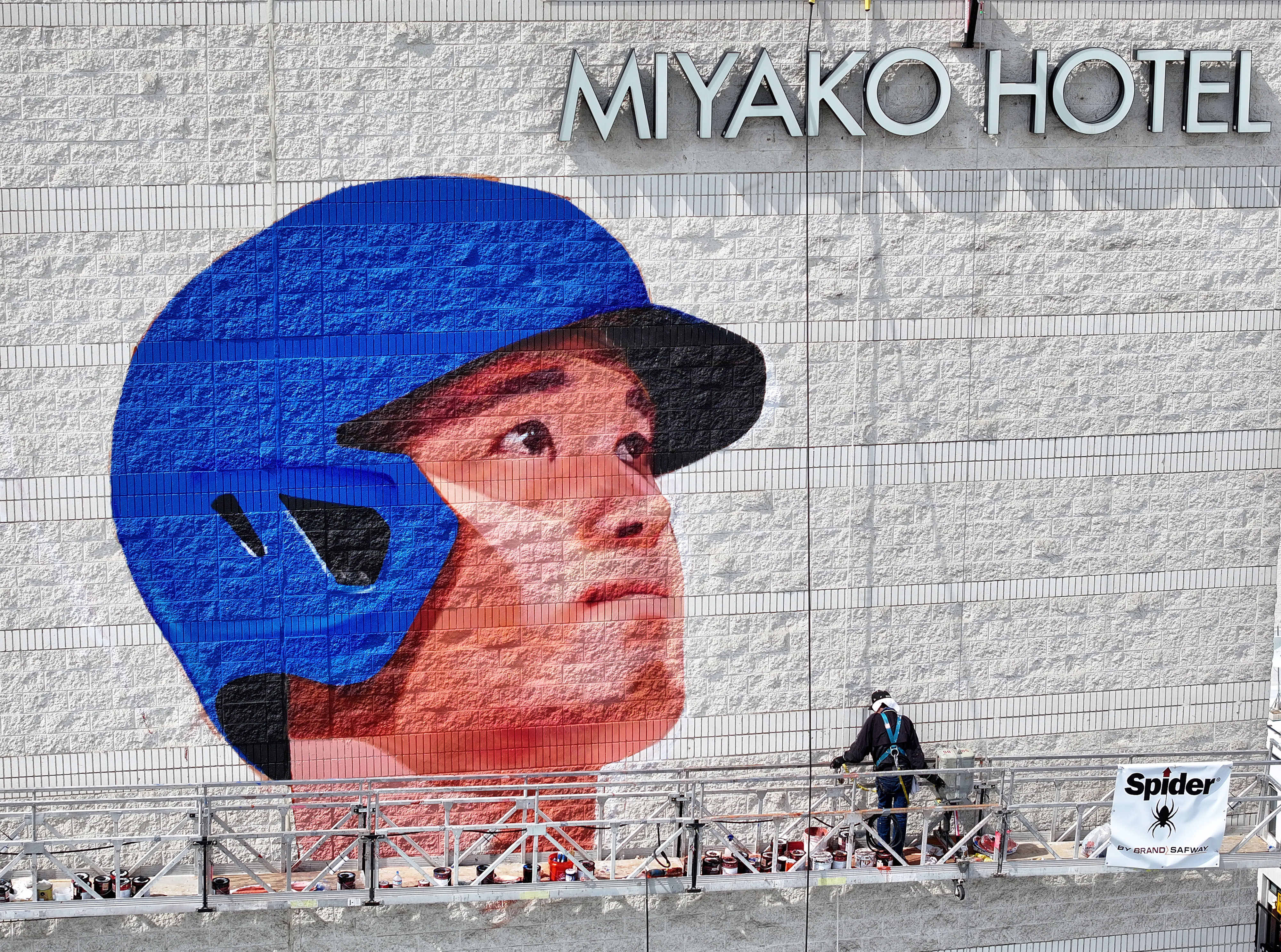 Muralist Robert Vargas works on a new Shohei Ohtani mural,...
