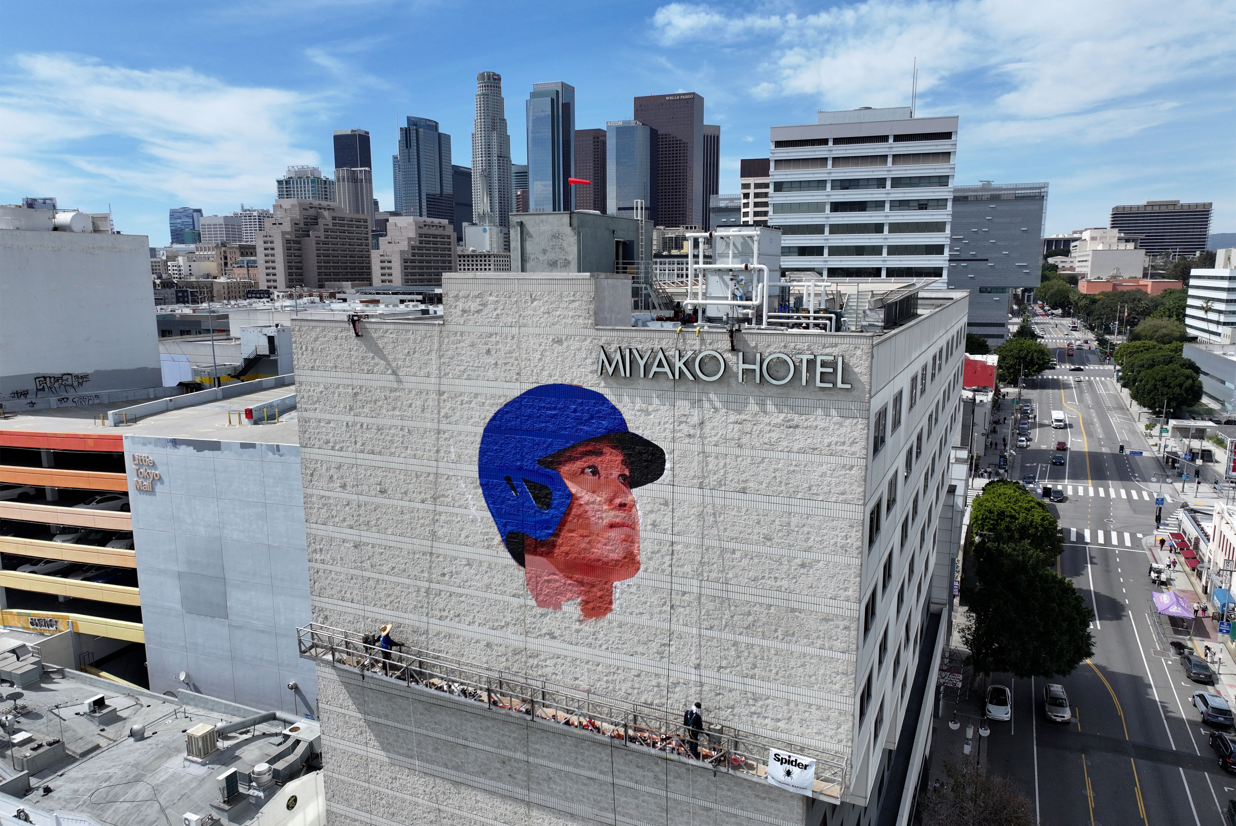 Muralist Robert Vargas works on a new Shohei Ohtani mural,...