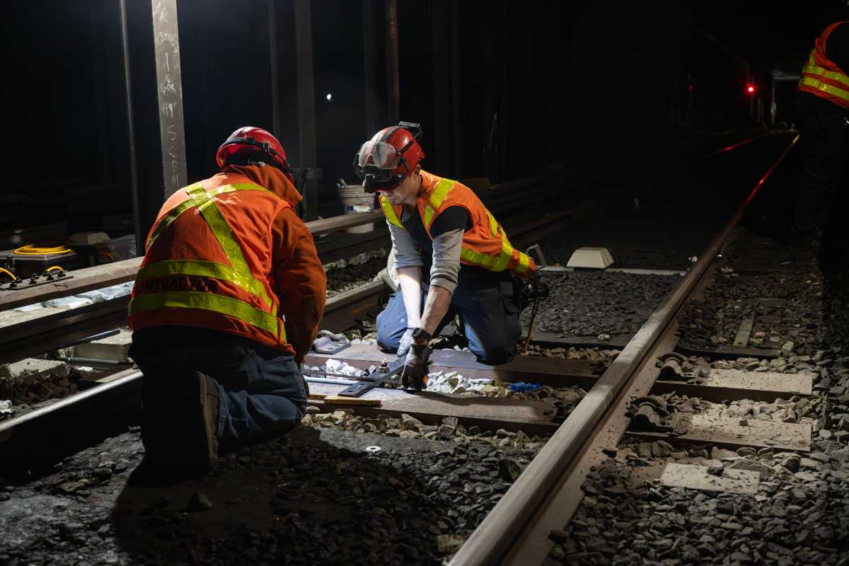 subway construction crews working on track