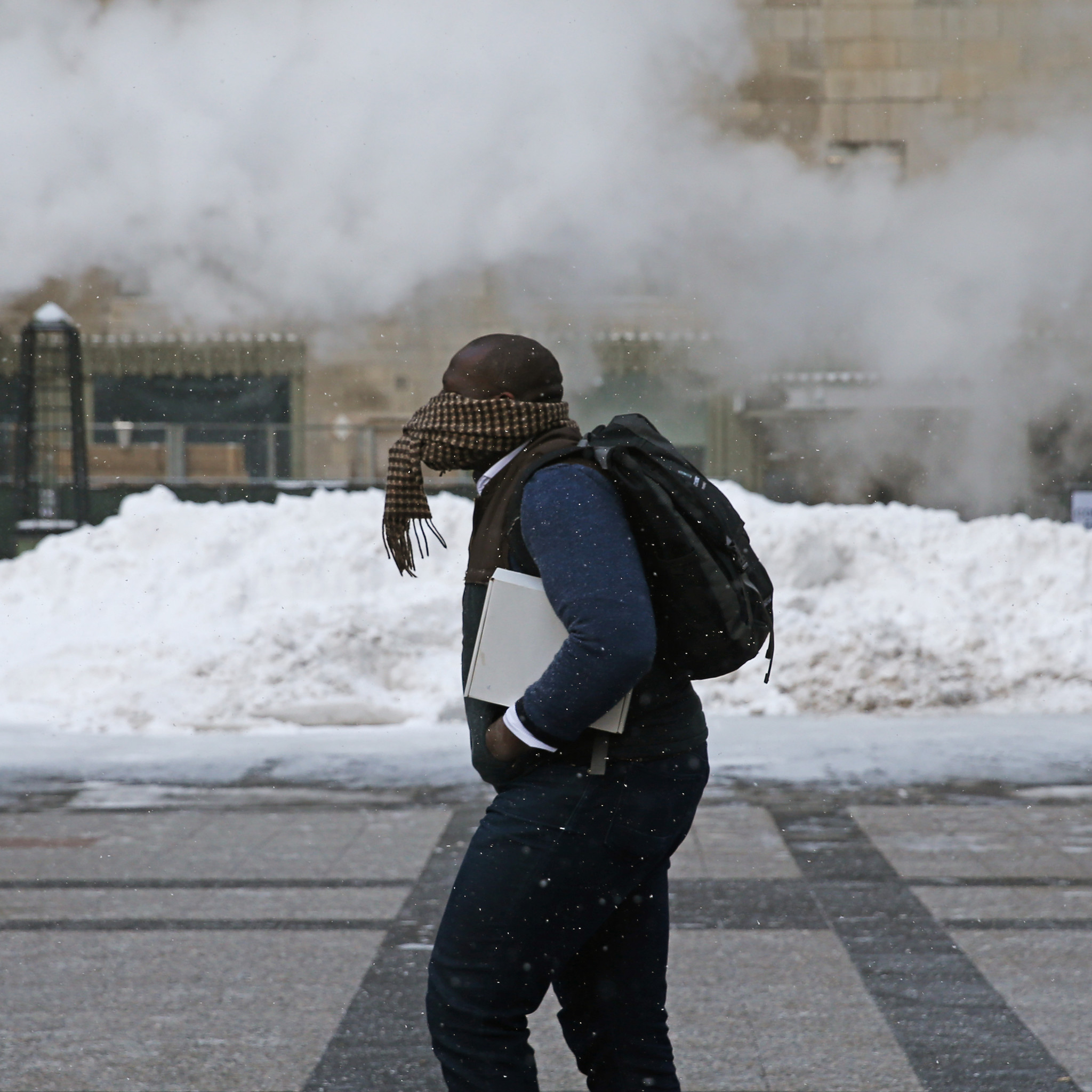 A man walks through Pioneer Plaza in the 400 block...