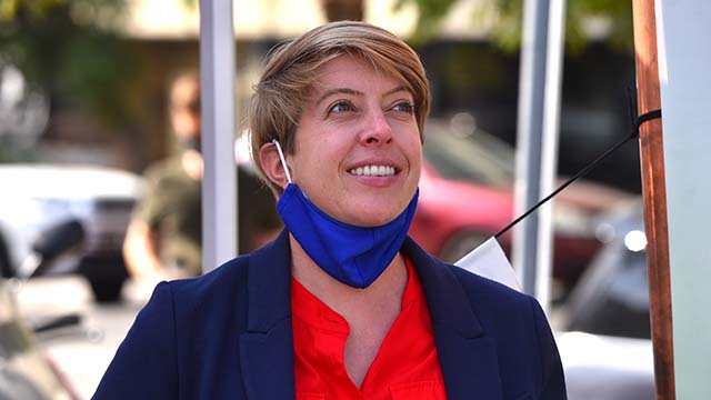 City Council candidate Marni Von Wilpert speaks to union workers at a car rally downtown on Election Day.