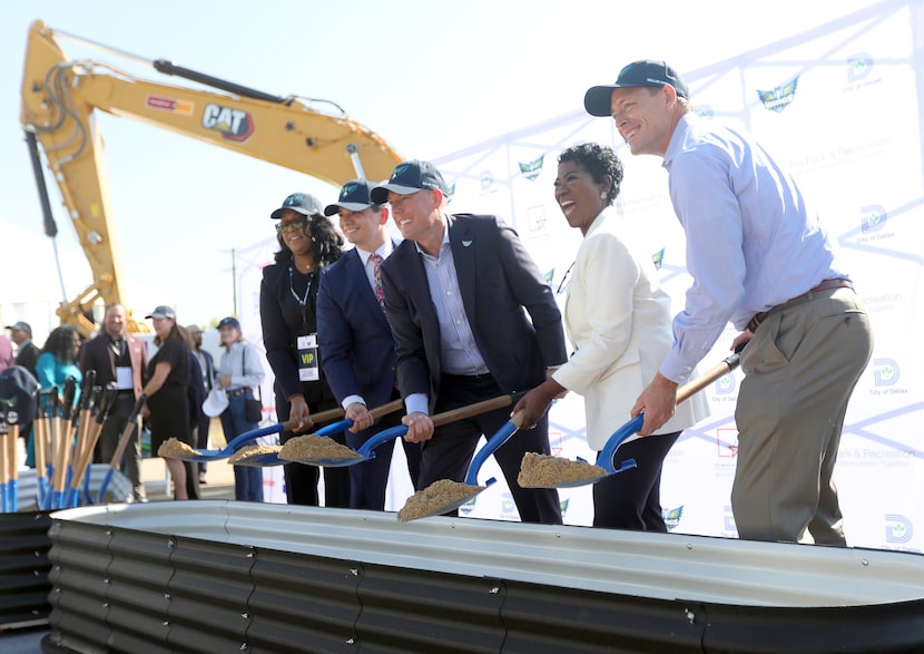 Wings CEO and president Greg Bibb, center, along with city officials as the Dallas Wings and...