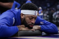 Dallas Mavericks forward Anthony Davis gets his leg worked out before an NBA basketball game...