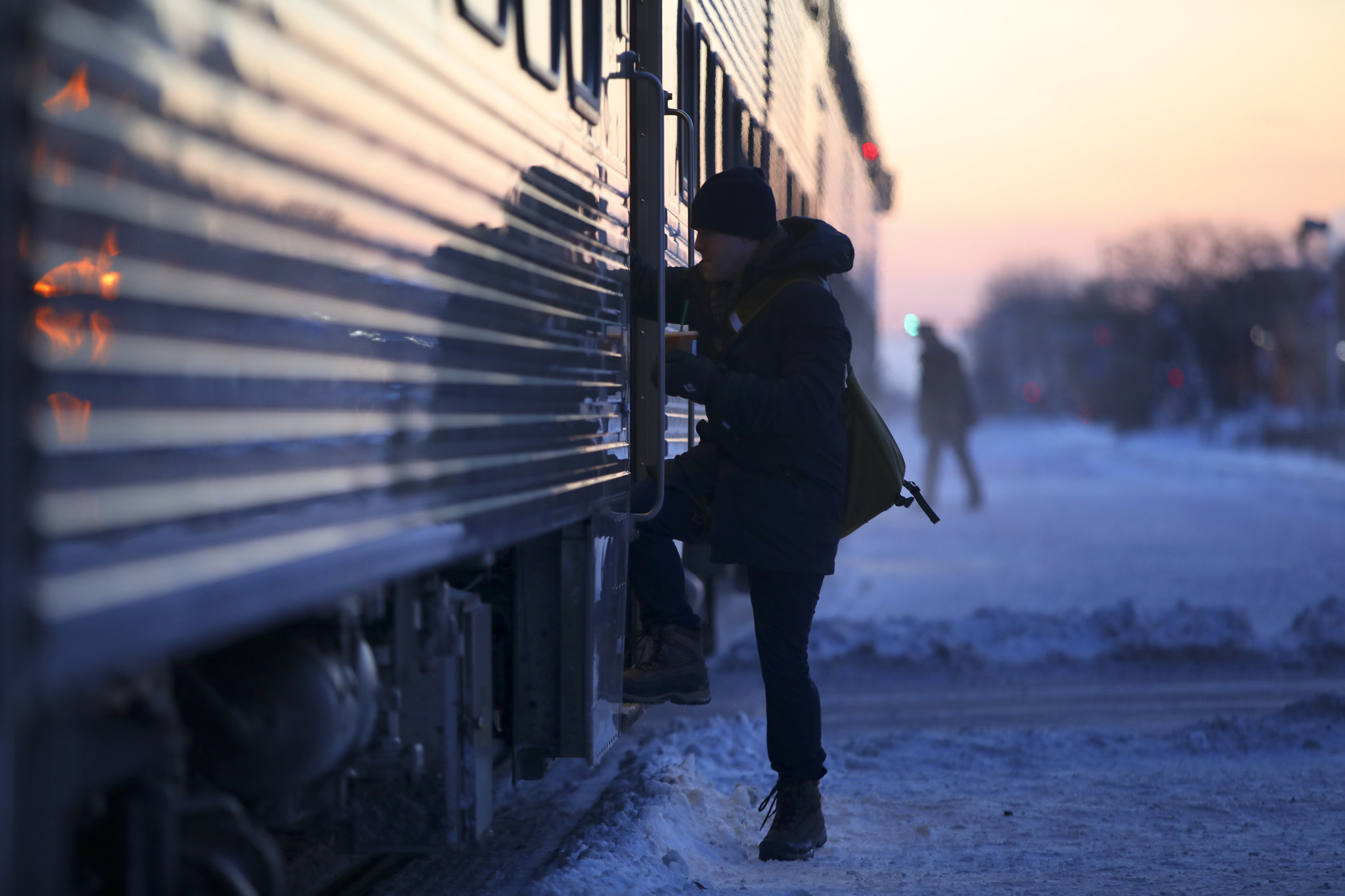 With temperatures around minus 20 degrees, early morning commuters board...